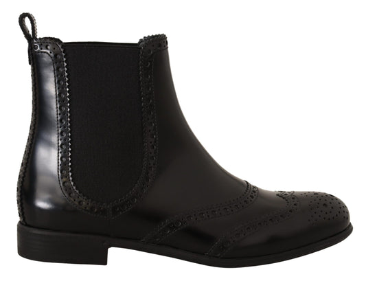 Mustat nahkaiset nilkkapituiset matalat saappaat Kengät